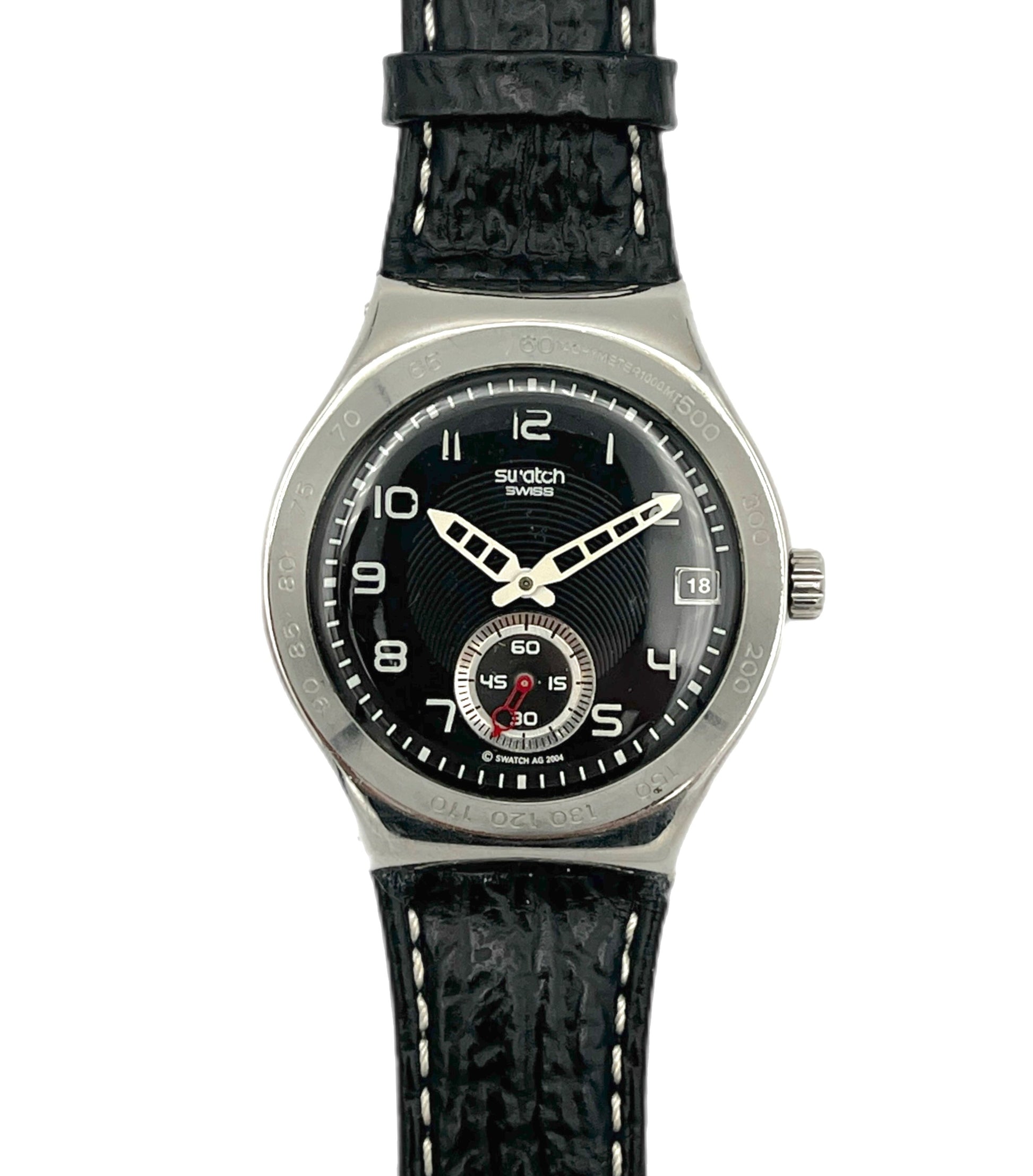 Swatch watch with black strap and black dial on a white background
