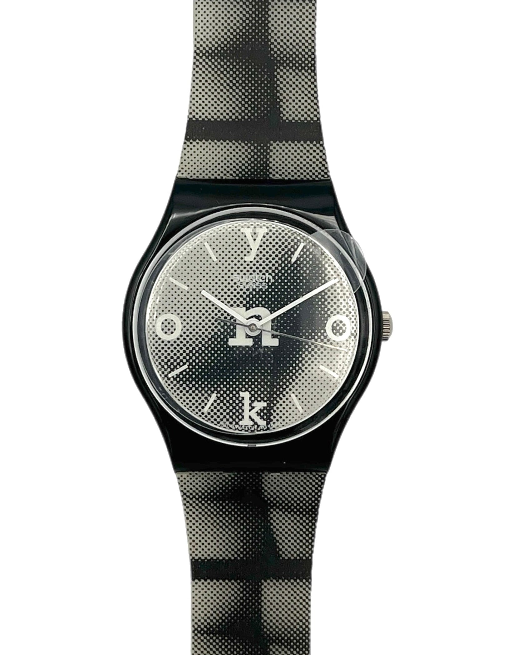 Wristwatch with black and gray checkered strap on a white background