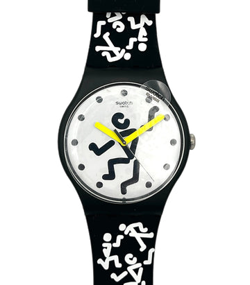 Swatch watch with black strap and white dial featuring black abstract designs on a white background