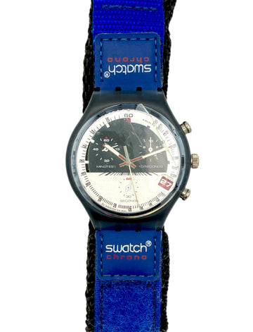 Swatch watch with blue strap and visible brand logo on a white background