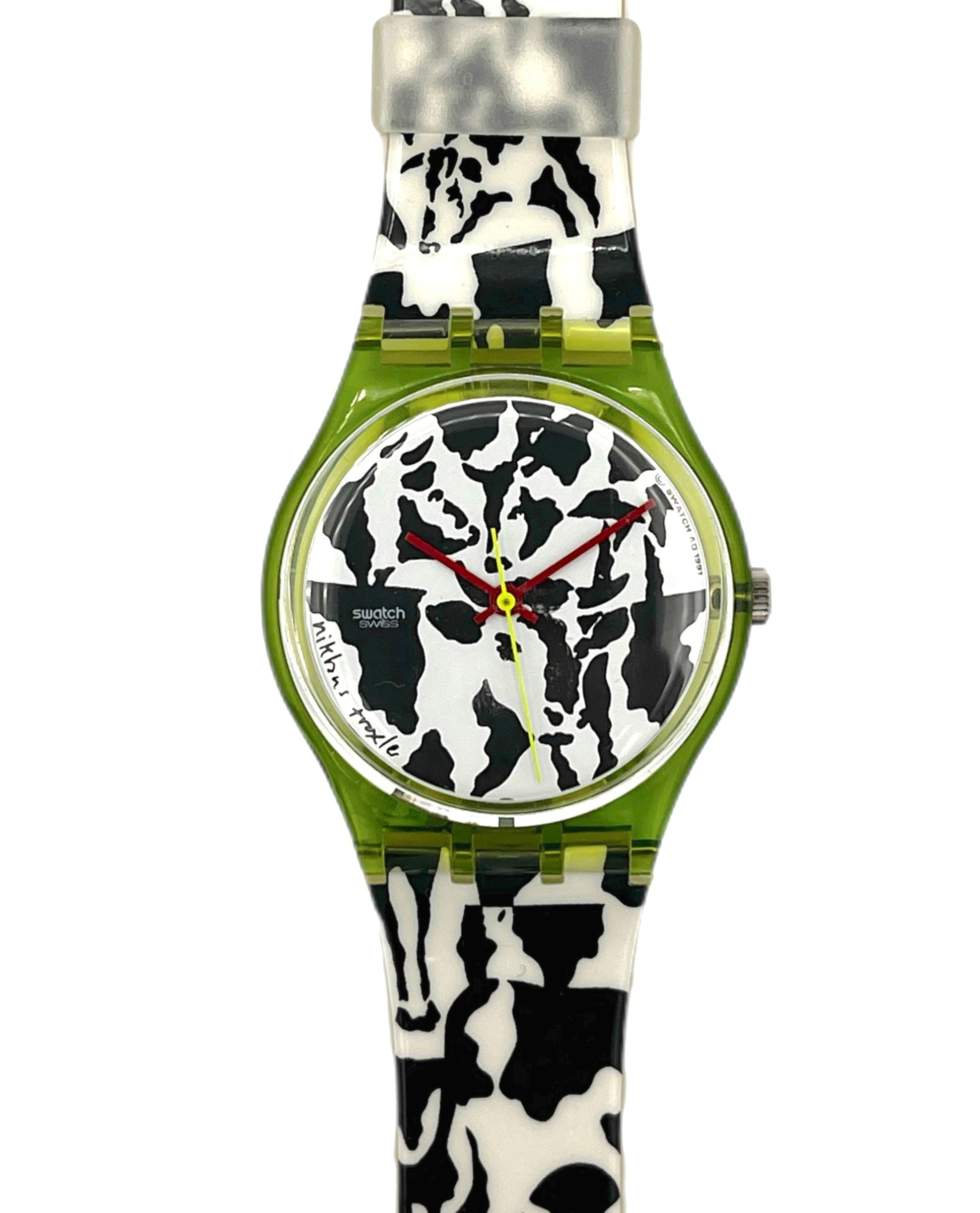 Watch with a cow print strap on a white background