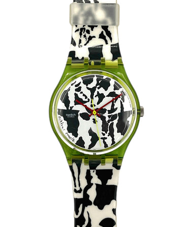 Watch with a cow print strap on a white background