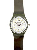 A vintage Swatch Duxx wristwatch with a dark olive green strap and case, featuring a white dial with black Arabic numerals and a day/date window.