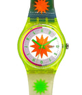 A Swatch brand wristwatch with a translucent neon yellow-green case and strap, featuring a white dial with an orange starburst design and colorful letter indices.