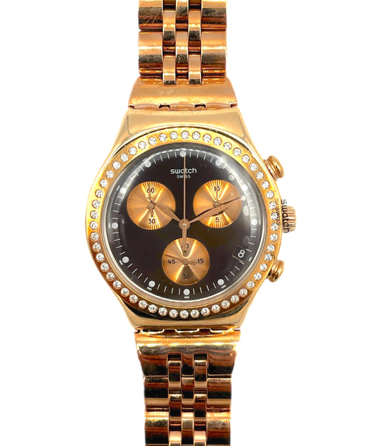 Gold watch with a black face on a white background