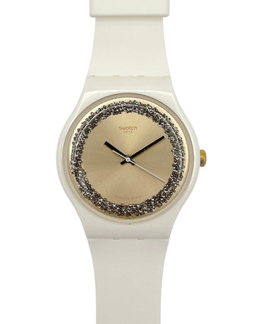 White Swatch watch with decorative face on a white background