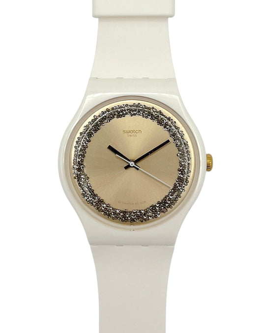 White Swatch watch with decorative face on a white background
